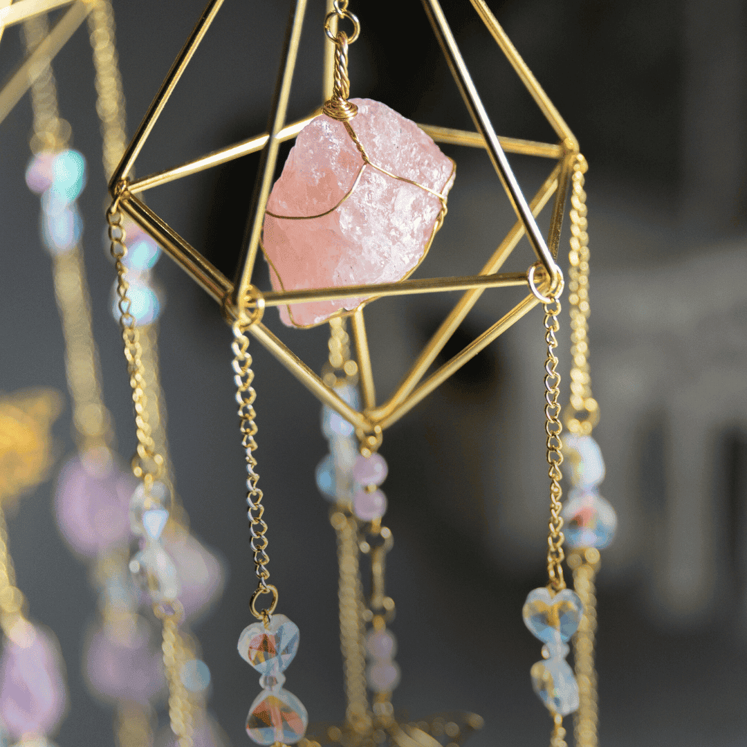Rose Quartz crystal in the metal cage of the Cleopatra's jewels suncatcher