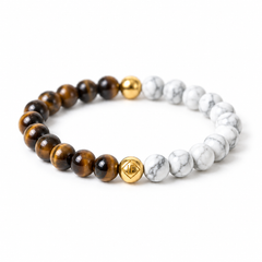 A beaded stretch bracelet featuring brown tiger's eye beads, white and gray marble beads, and polished gold-toned metal beads, displayed on a clean white background.